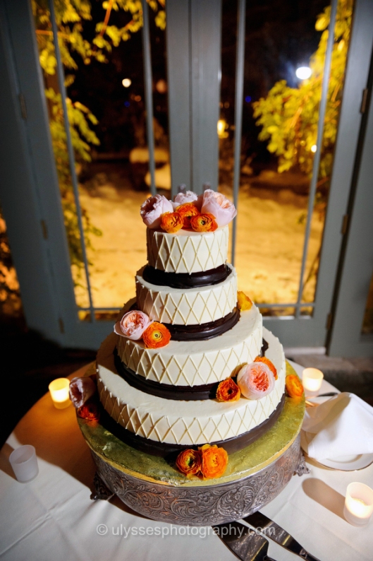 The cake was decorated with fresh Orange Ranunculus and Peach Garden Roses